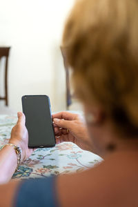 Midsection of woman using mobile phone