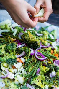 Cropped hands of person preparing food