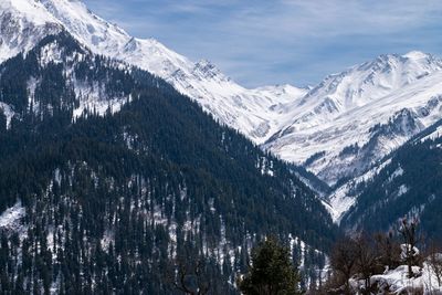 Scenic view of snowcapped mountains against sky