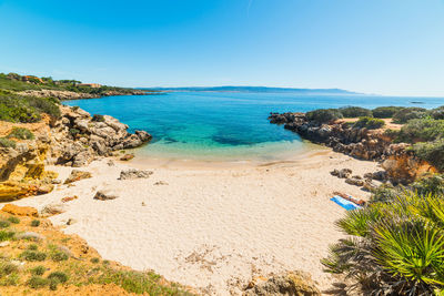 Scenic view of sea against clear blue sky