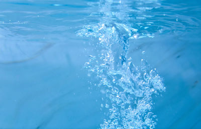Close-up of water splashing in swimming pool