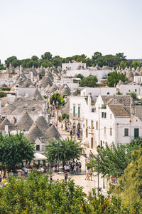 High angle view of trees and buildings against sky