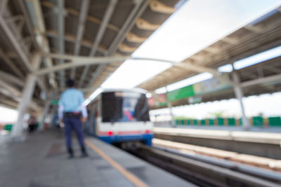 People waiting at railroad station platform