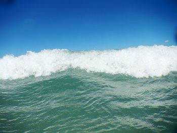 Scenic view of sea against clear blue sky
