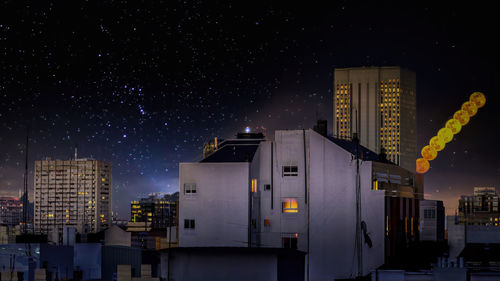 Illuminated buildings in city at night