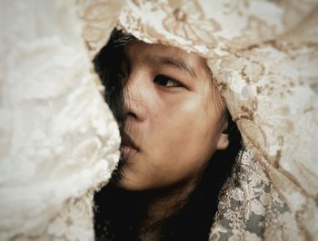 Low angle view of girl in veil