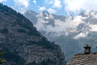 Low angle view of mountain range against sky