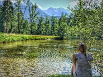 Scenic view of lake with mountains in background