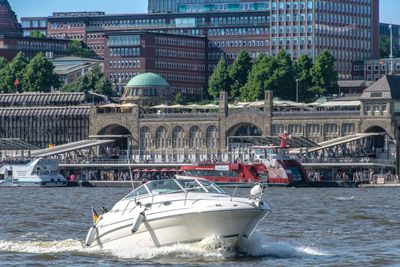 View of boats in city at waterfront