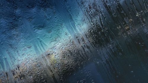 Close-up of water drops on glass