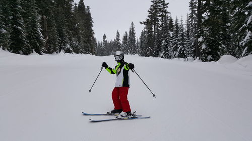 Full length of person skiing on snow covered field