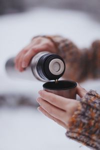 Close-up of hand holding camera