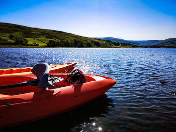 Boat in lake against sky