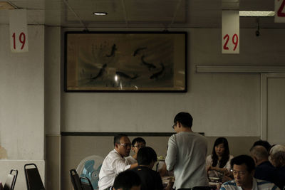 Group of people looking at store