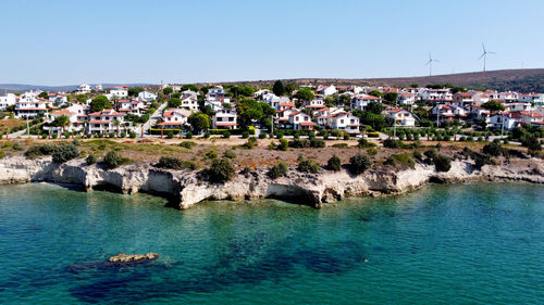 Panoramic view of sea and buildings against clear sky