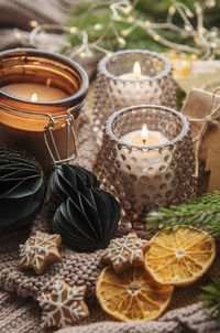 Advent decoration and gift boxes with burning candles. christmas background