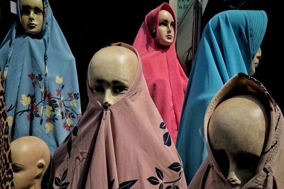 Close-up of mannequins wearing hijab outdoors