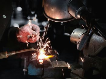Close-up of man welding metal