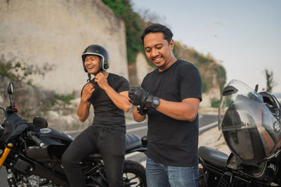 Portrait of man riding motorcycle on street