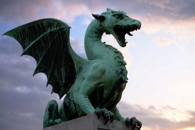 Low angle view of statue against sky