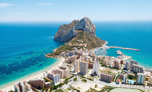 High angle view of sea and buildings against sky