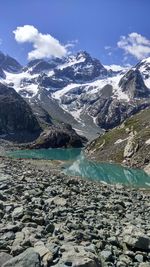 Scenic view of snowcapped mountains against sky