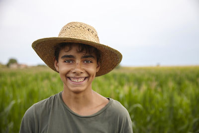 Portrait of man wearing hat against sky