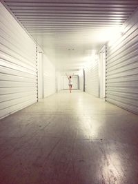 Woman walking in tunnel