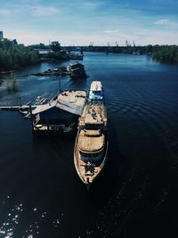 High angle view of boats moored in river against sky