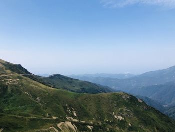 Scenic view of mountains against clear blue sky