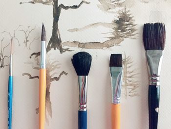 Close-up of paintbrushes on table