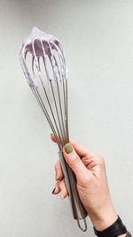 Whisk with blueberry meringue