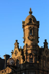 Low angle view of church against blue sky