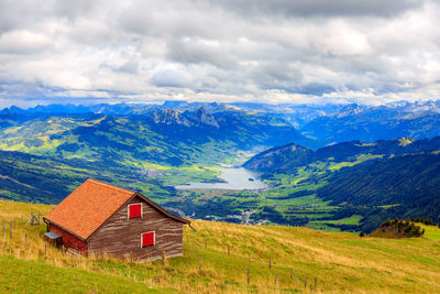 Scenic view of landscape and mountains against sky