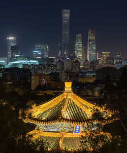 High angle view of illuminated buildings in city at night