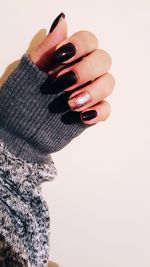 Close-up of woman hand over white background