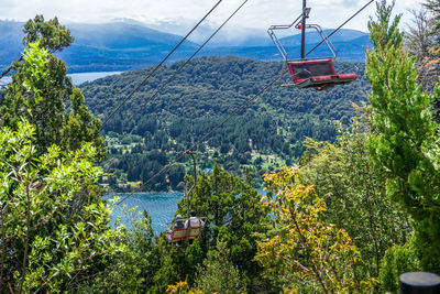 Scenic view of overhead cable car over mountains