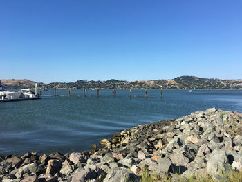 Scenic view of sea against clear blue sky