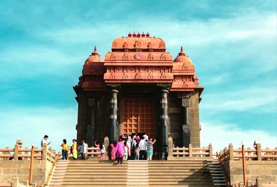 Group of people in front of historical building