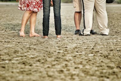 Low section of people on dirt road