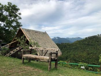 Built structure on field against sky