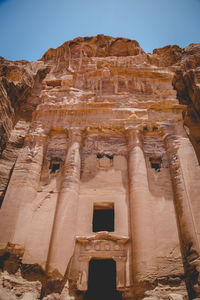 Low angle view of old ruins against clear sky