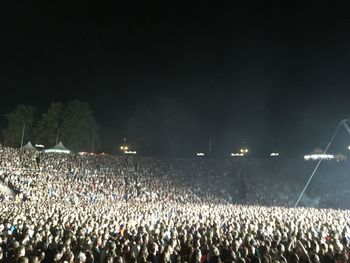 Panoramic view of crowd at music concert