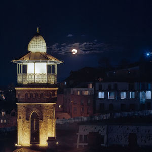 Illuminated buildings in city at night