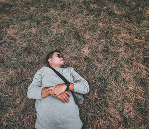 High angle view of young man standing on field