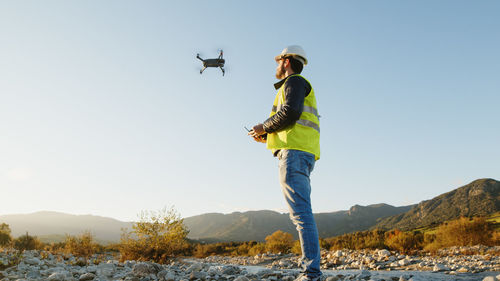 Geologist with drone check the state of the environment and the territory