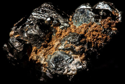 Close-up of rocks against black background