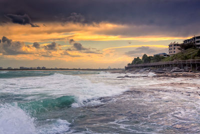 Scenic view of sea against dramatic sky