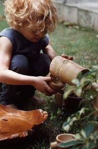 Side view of boy looking through window