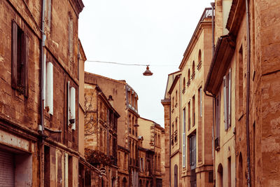 High angle view of street buildings against clear sky